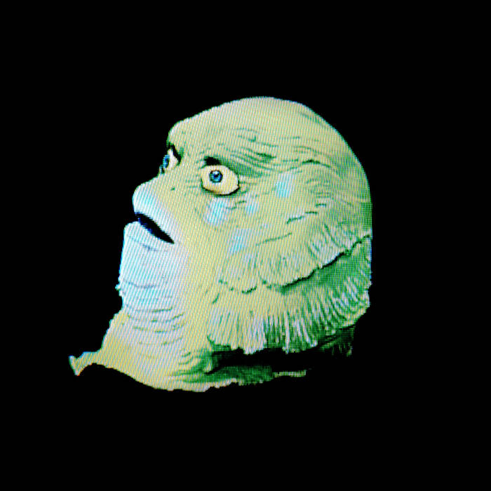 The Cover Art for Halloween Dreams features a photograph of a green latex monster mask against a black background.